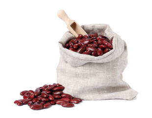 Dried red beans in burlap with scoop isolated on white