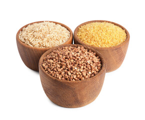 Different cereal grains in wooden bowls isolated on white