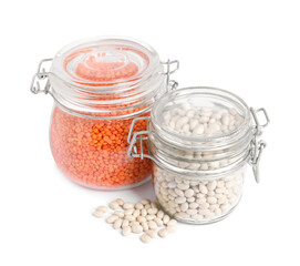 Raw beans and lentils in glass jars isolated on white