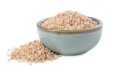 Dry wheat groats in bowl isolated on white