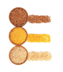 Different types of cereals in bowls isolated on white, top view