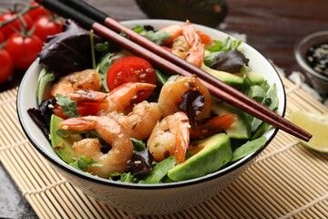 Delicious shrimp salad in bowl on table, closeup