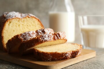 Freshly baked sponge cake on light grey table, closeup