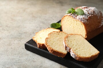 Freshly baked sponge cake on light grey table