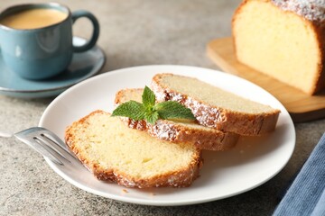 Freshly baked sponge cake and coffee on light grey table