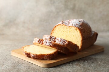Freshly baked sponge cake on light grey table