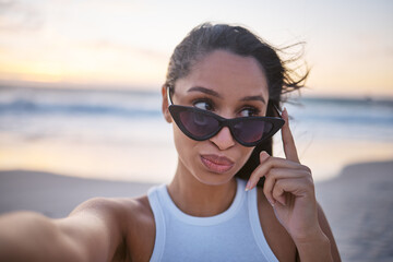 Beach, woman and sunglasses with selfie on holiday for social media post and profile picture in Mauritius. Female person, smile and portrait on summer vacation for memories, relax and break on breeze