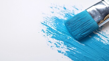 Fototapeta premium Blauer Farbtopf mit Pinsel auf weißem Hintergrund, ideal für Renovierungsprojekte, bietet vielseitige Anwendungsmöglichkeiten und inspirierende Gestaltungsideen.