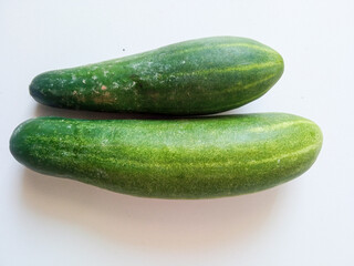Fresh cucumber isolated on white