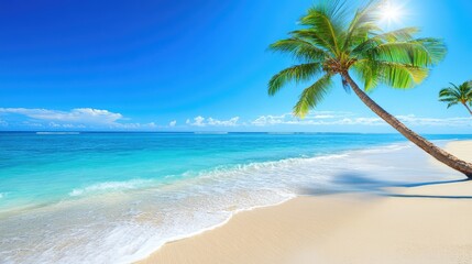 A serene beach scene with clear blue water, golden sand, and swaying palm trees.