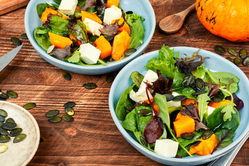 Pumpkin salad with pumpkin seeds.