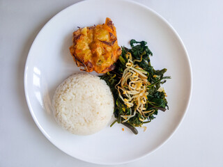 Urap Sayur. healthy and traditional indonesian food isolated on white