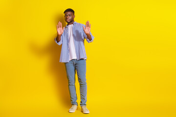 Full length photo of serious confident guy dressed checkered shirt showing arms no emtpy space...