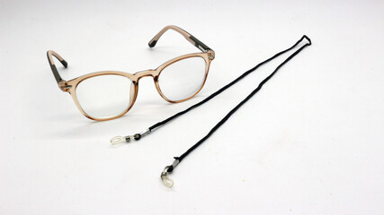 Brown glasses with black eyeglass strap