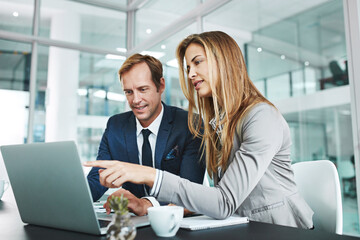 Man, woman and laptop on office for research, meeting and advice for company growth. People, computer and discussion in workplace for teamwork, brainstorming or budget planning for financial year end