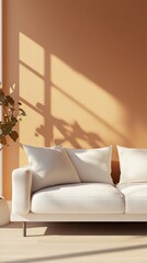 Minimalist living room bathed in warm sunlight, featuring a pristine white sofa against a terracotta wall with dramatic window shadow play and a potted plant.