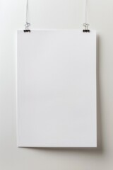 A simple white sign hangs on a white wall, providing a clean and minimalist backdrop for any concept