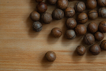 unpeeled macadamia nut textured background