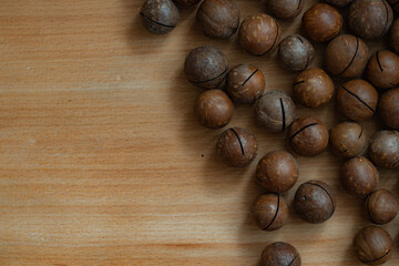 unpeeled macadamia nut textured background