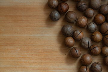 unpeeled macadamia nut textured background
