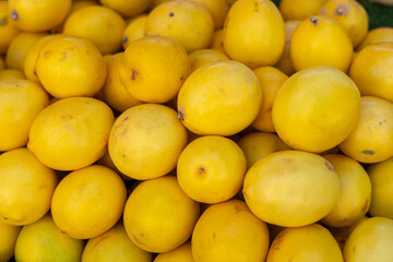 yellow lemons placed together as background