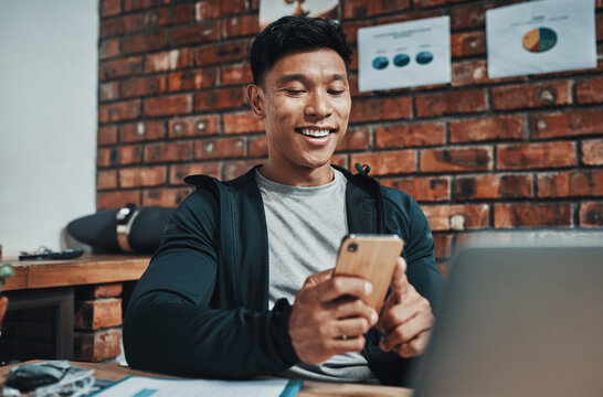 Man, fitness instructor and phone with reading at gym office for schedule, smile and social media. Personal trainer, smartphone and texting with app, notification and contact client for exercise plan