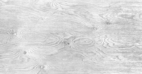 Obraz premium A wooden surface with a grainy texture. The wood is white and has a natural look. The surface is smooth and has a slight shine to it