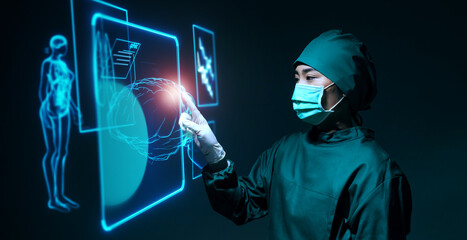 Female asian doctor specialist brain surgeon using computer holographic display screen technology...
