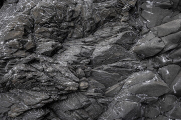 quartz filled veins and vesicles in fractured basalt, Reynisfjara beach , Vík, South Iceland