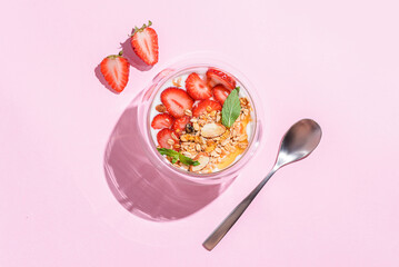 yogurt with strawberries, granola and honey