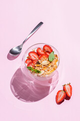 yogurt with strawberries, granola and honey