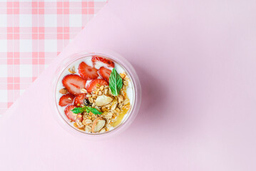 yogurt with strawberries, granola and honey