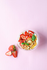 yogurt with strawberries, granola and honey