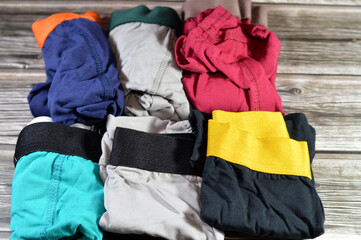 Pile of cotton boxer shorts kids' wear underwear in plain colors, loose boxers are type of...