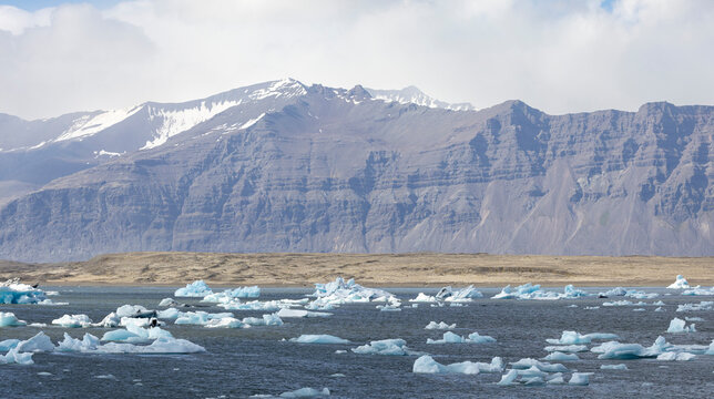 snow covered mountains and hundreds of icebergs in the glacial lake, Iceland