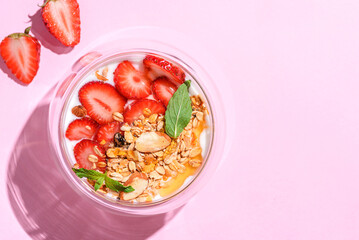 yogurt with strawberries, granola and honey