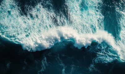 Aerial View of Ocean Waves Crashing Against Shoreline