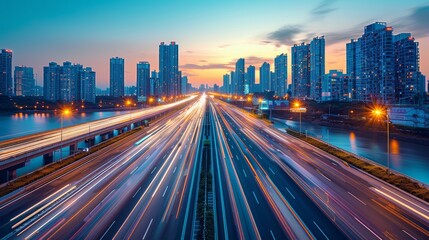 Fototapeta premium Highway overpass motion blur with city background .