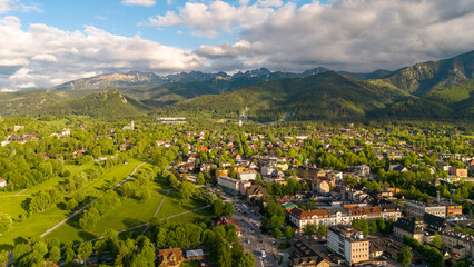 aerial view of the city of Zakopane and the city around in the evening in Poland at sunset