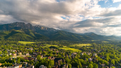 aerial view of the city of Zakopane and the city around in the evening in Poland at sunset