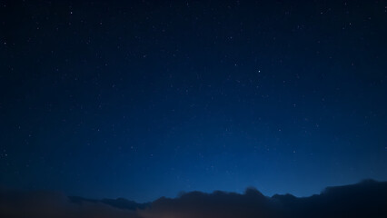 Fototapeta premium Starry night sky with clouds on the horizon, Generative AI