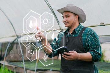 Smart farmer using tablet technology analyzing water moisture soil plant health air quality...
