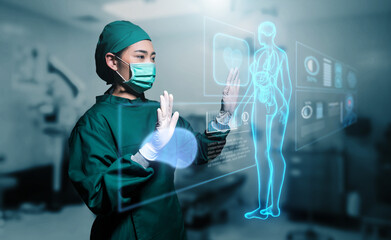 Asian female doctor specialist surgeon using computer human body anatomy display screen technology...