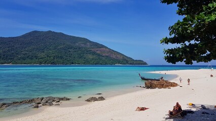 Beach with boats , beautyful resort in koh lipe thailand.