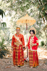 Fototapeta premium Asian Indonesian Couple Wearing Traditional Bugis Clothing, Pinrang South Sulawesi. Indonesia