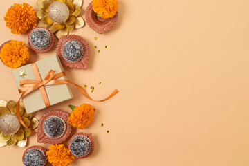 Diwali party background with sweet traditional dessert, gift box and decorations. Top view, flat lay