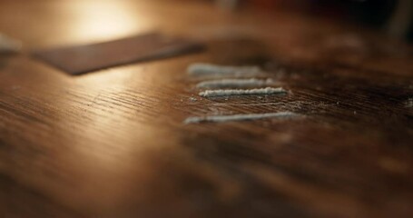 Hands, money and snorting with drugs, powder and addiction with substance abuse at event. Person, nightclub and party with cash to sniff narcotics, cocaine and illegal product at social lounge - Powered by Adobe