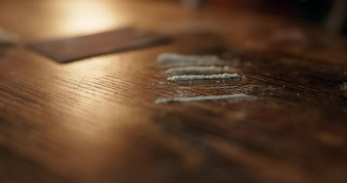 Hands, money and snorting with drugs, powder and addiction with substance abuse at event. Person, nightclub and party with cash to sniff narcotics, cocaine and illegal product at social lounge