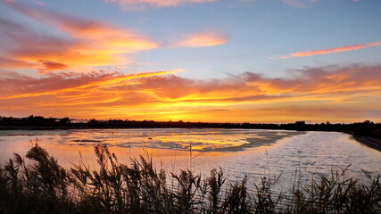 Sunset in fall over the Po River Delta in Italy