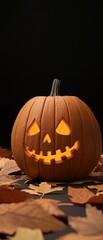 A carved pumpkin with a glowing face, surrounded by autumn leaves, perfect for Halloween-themed decorations and celebrations.